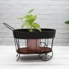 Porte Plante Vintage noir sur une table